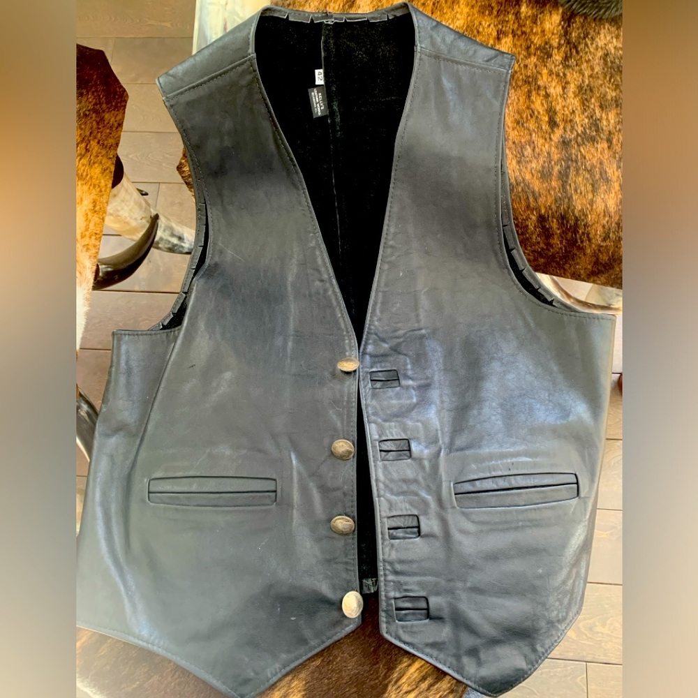 Add edge to your style with real this buffalo head nickel buttoned leather vest